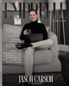 Jason Carson sitting on a gray sofa in a modern office setting.